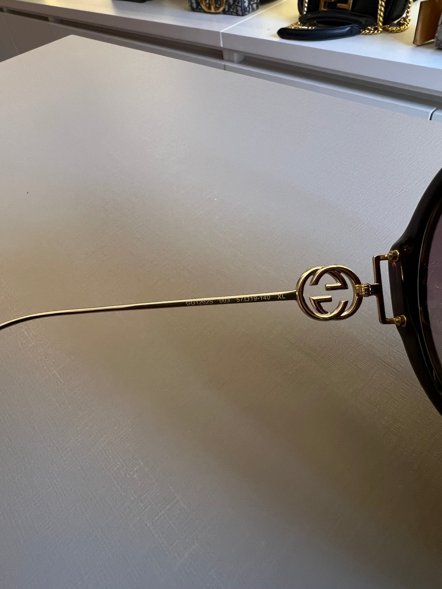 Óculos de Sol Gucci Round Interlock