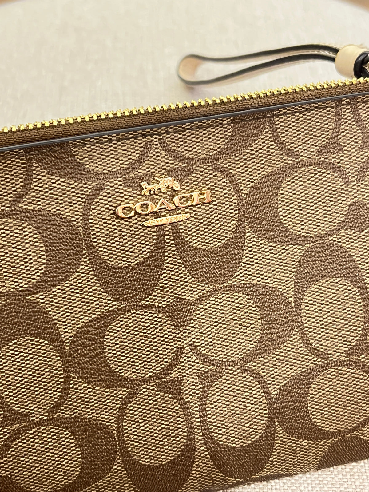 Pochette Coach Monograma