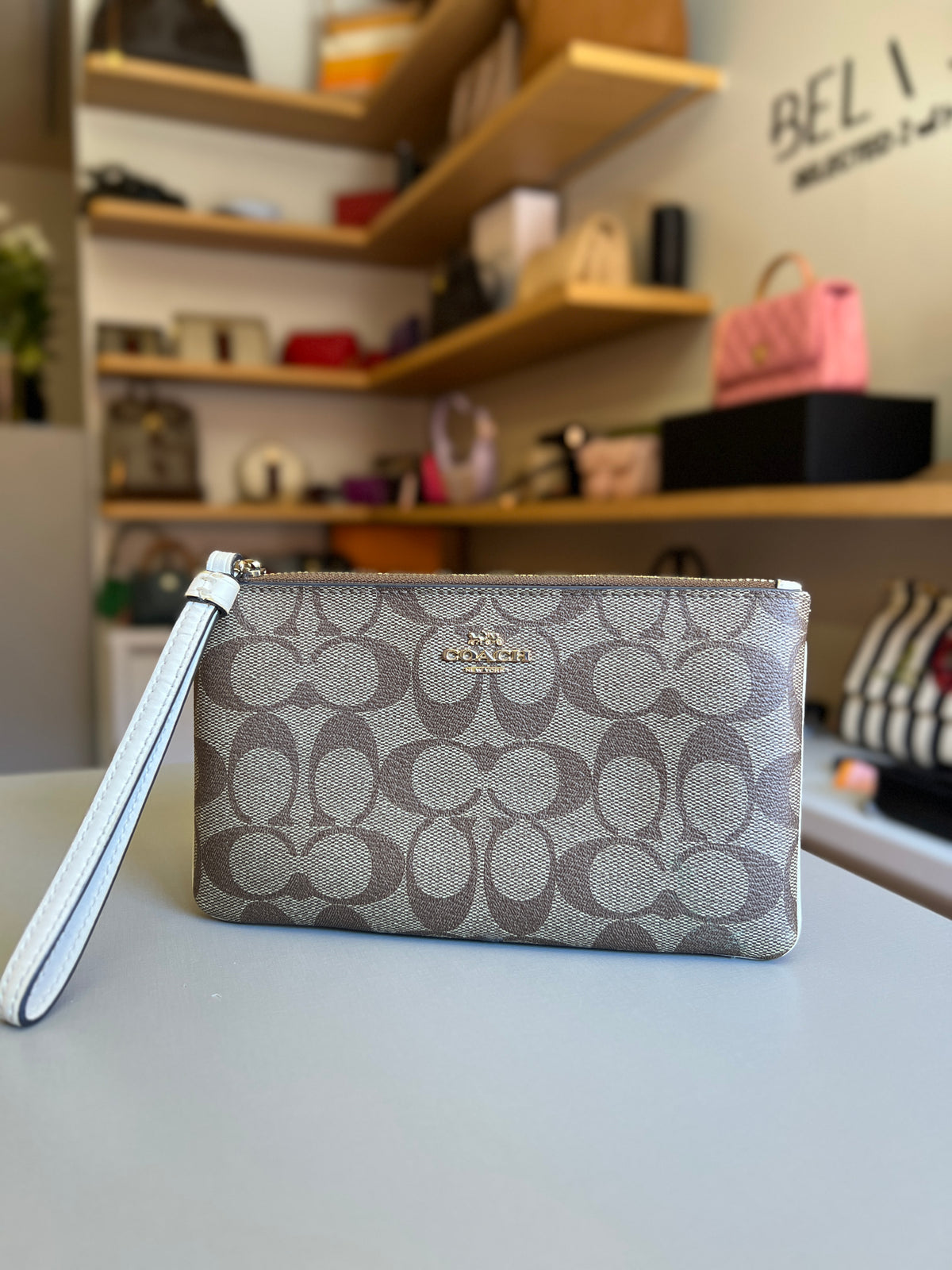Pochette Coach Monograma