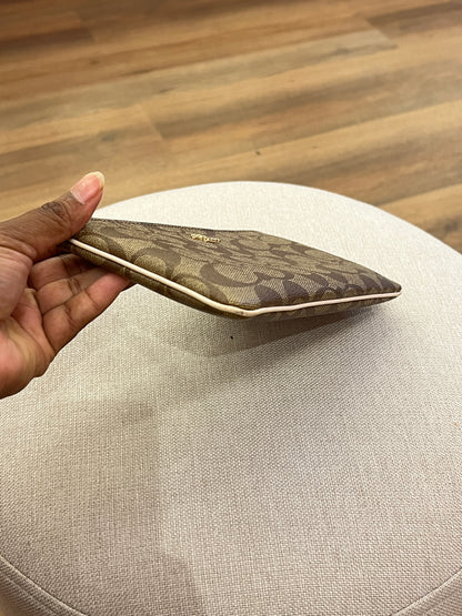 Pochette Coach Monograma